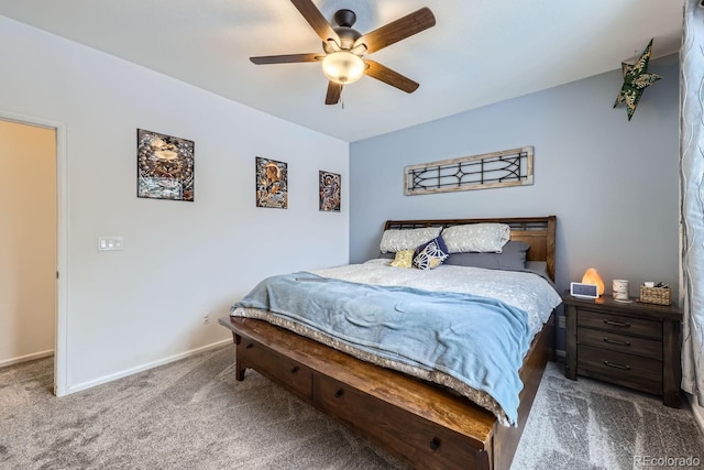 carpeted bedroom featuring a ceiling fan and baseboards