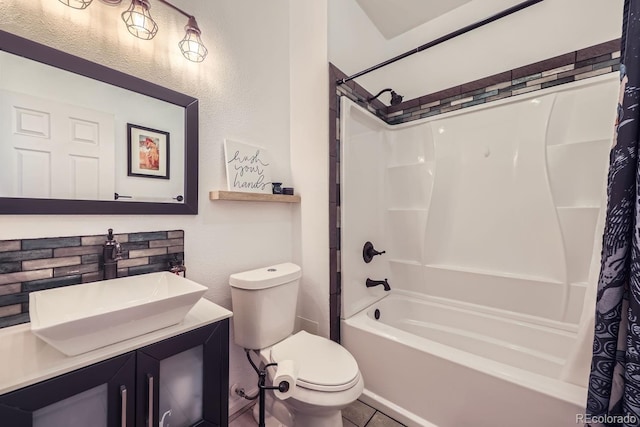 full bathroom featuring toilet, a textured wall, shower / bath combination with curtain, and vanity