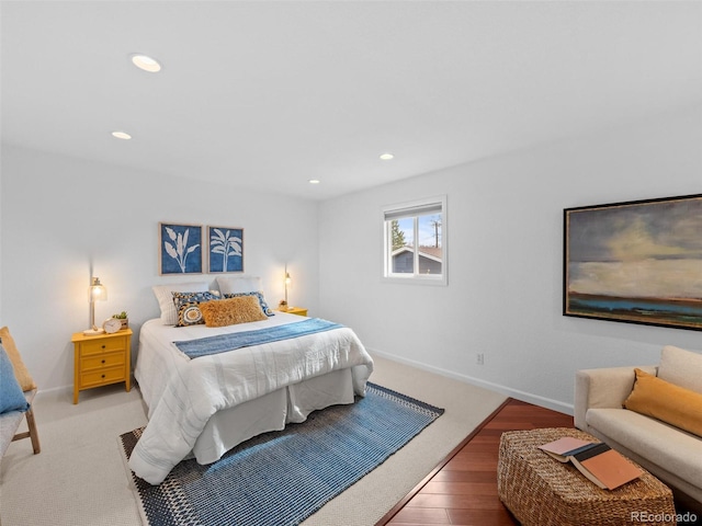 bedroom with recessed lighting, baseboards, and wood finished floors