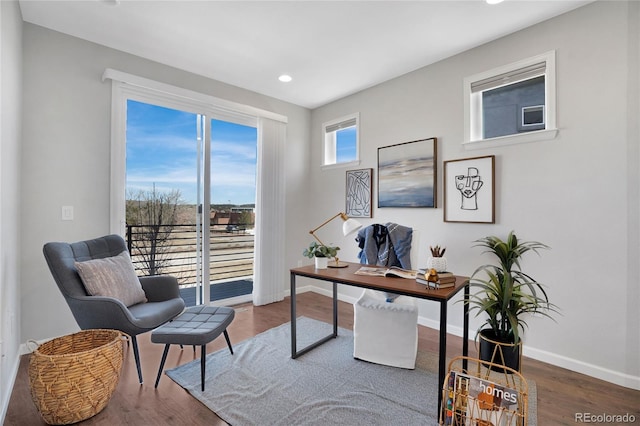 home office featuring recessed lighting, wood finished floors, and baseboards