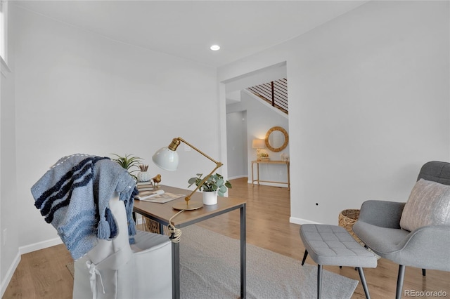 office space with recessed lighting, baseboards, and wood finished floors