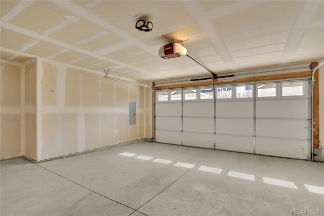 garage featuring electric panel and a garage door opener