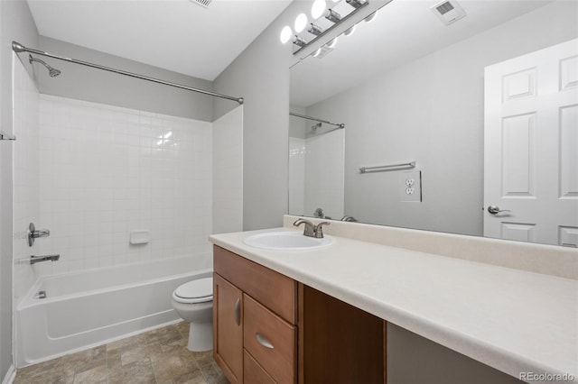 bathroom featuring toilet, washtub / shower combination, vanity, and visible vents