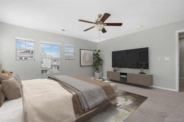 bedroom with baseboards, visible vents, ceiling fan, and carpet flooring