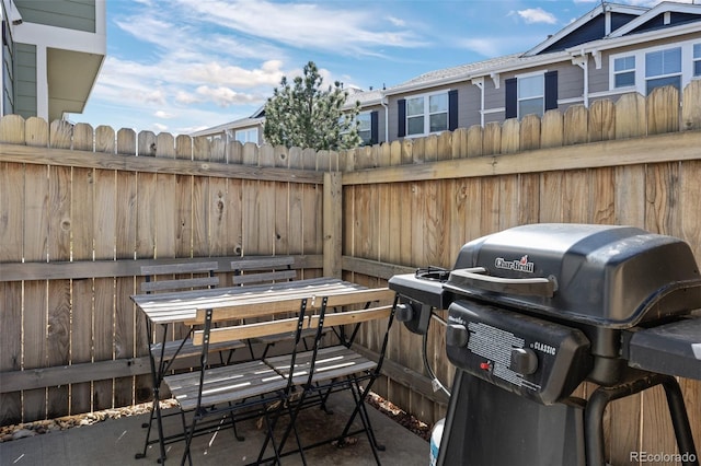 view of patio featuring fence and grilling area