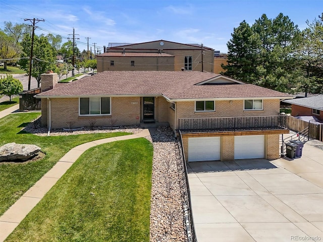 2704 S Ames Way, Denver, CO 80227 - view of front of home with brick siding, roof with shingles, driveway, and an attached garage