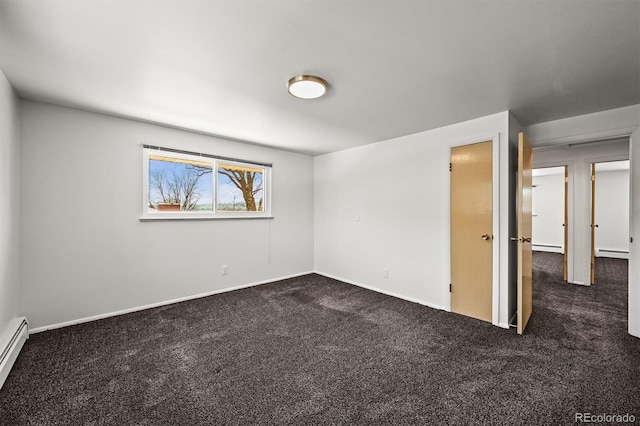 2704 S Ames Way, Denver, CO 80227 - empty room featuring dark carpet, baseboards, a baseboard radiator, and a baseboard heating unit