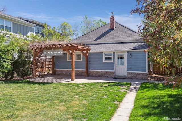 5101 Meade St, Denver, CO 80221 - rear view of property featuring roof with shingles, stone siding, a patio, a pergola, and a chimney