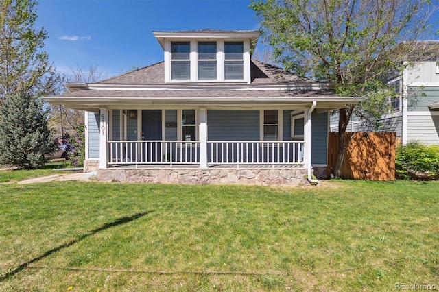 5101 Meade St, Denver, CO 80221 - view of front of home featuring covered porch, a shingled roof, and a front lawn