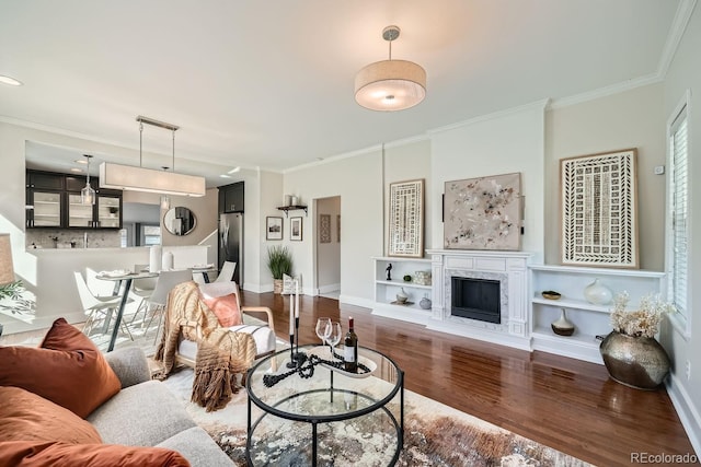 5101 Meade St, Denver, CO 80221 - living area with baseboards, ornamental molding, built in features, and wood finished floors