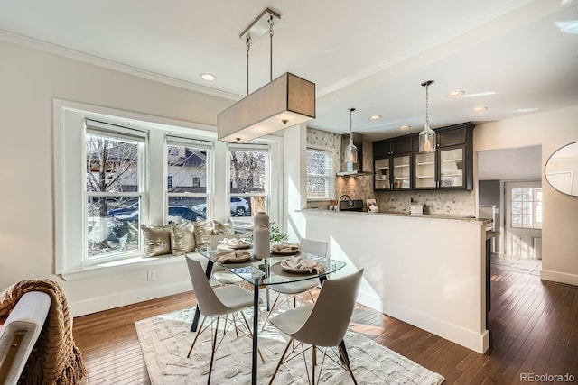 5101 Meade St, Denver, CO 80221 - dining room with dark wood-type flooring, baseboards, ornamental molding, and recessed lighting