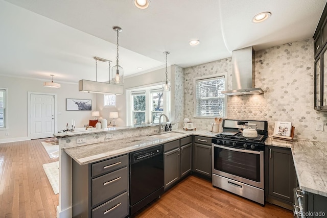 5101 Meade St, Denver, CO 80221 - kitchen featuring a sink, a peninsula, wall chimney range hood, stainless steel range with gas stovetop, and dishwasher