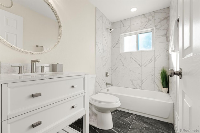 bathroom with marble finish floor, recessed lighting, toilet, tub / shower combination, and vanity