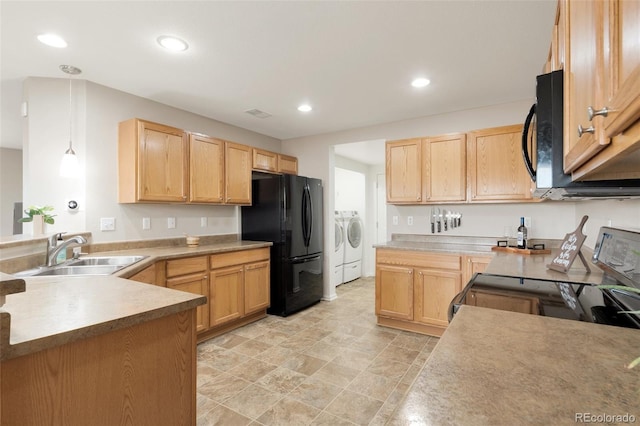 kitchen featuring washing machine and dryer, recessed lighting, a sink, light brown cabinetry, and black appliances