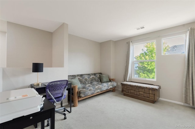 home office featuring light carpet, baseboards, and visible vents