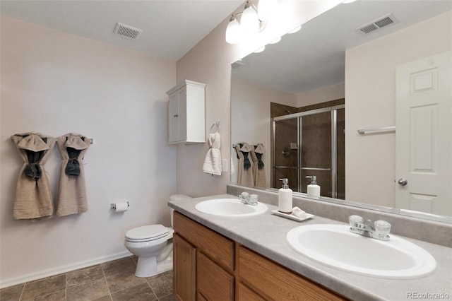 bathroom with a sink, visible vents, and a shower stall