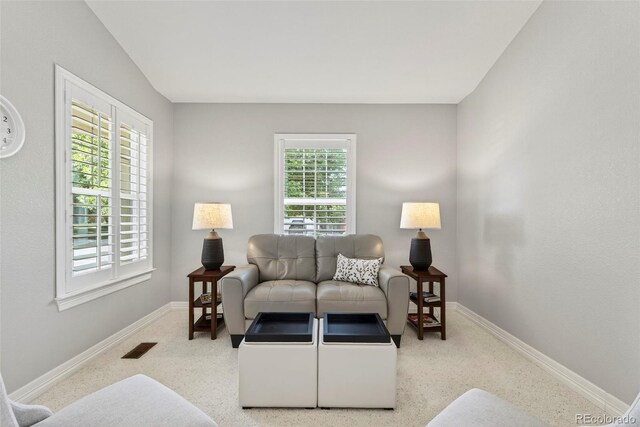829 Sanctuary Cir, Longmont, CO 80504 - living room featuring healthy amount of natural light and carpet flooring