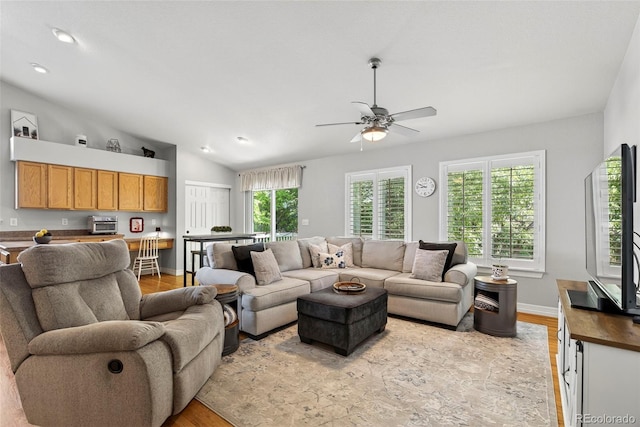 829 Sanctuary Cir, Longmont, CO 80504 - living room featuring light wood-type flooring, ceiling fan, vaulted ceiling, and recessed lighting