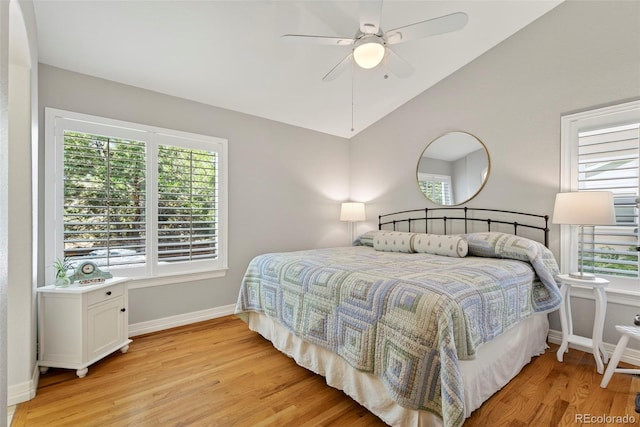 829 Sanctuary Cir, Longmont, CO 80504 - bedroom featuring light wood-style floors, multiple windows, vaulted ceiling, and ceiling fan