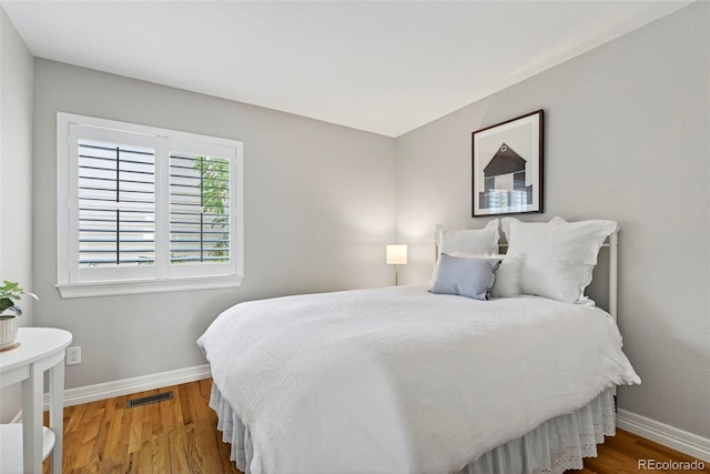829 Sanctuary Cir, Longmont, CO 80504 - bedroom featuring baseboards and wood finished floors
