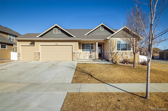 craftsman house featuring a garage and covered porch