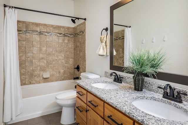 full bathroom with tile patterned floors, vanity, toilet, and shower / bath combo with shower curtain