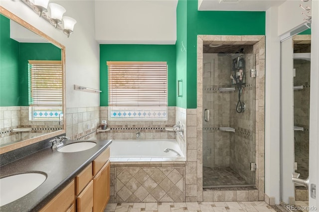 1510 S De Gaulle Cir, Aurora, CO 80018 - bathroom featuring a garden tub, a stall shower, double vanity, and tile patterned flooring