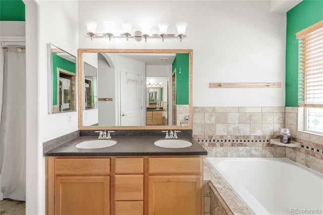 1510 S De Gaulle Cir, Aurora, CO 80018 - bathroom with a garden tub and double vanity