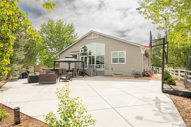 1510 S De Gaulle Cir, Aurora, CO 80018 - back of house featuring an outdoor living space, a patio, a gazebo, fence, and crawl space