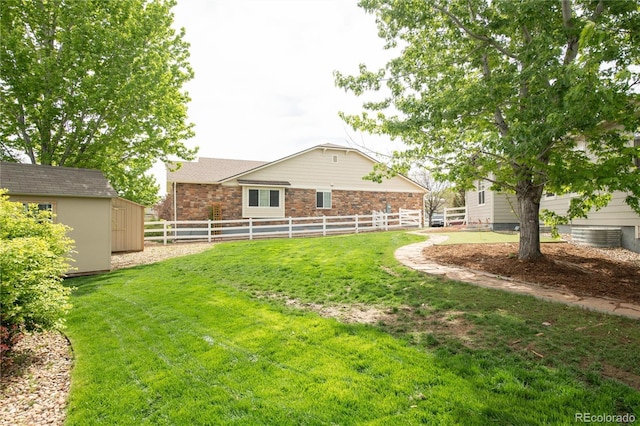 1510 S De Gaulle Cir, Aurora, CO 80018 - view of yard with a shed and an outbuilding