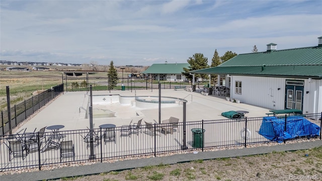 view of home's community featuring fence and a patio