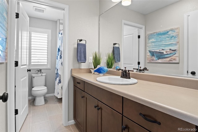 full bathroom with vanity, baseboards, and toilet