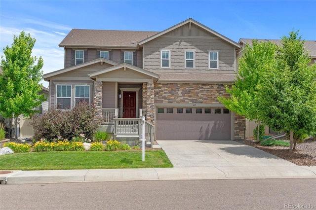 6185 Saddle Bow Ave, Parker, CO 80134 - view of front of home with an attached garage, concrete driveway, a front lawn, and stone siding