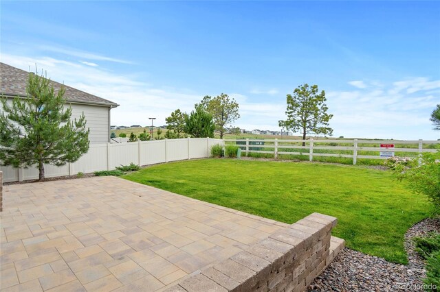 6185 Saddle Bow Ave, Parker, CO 80134 - fenced backyard featuring a patio area