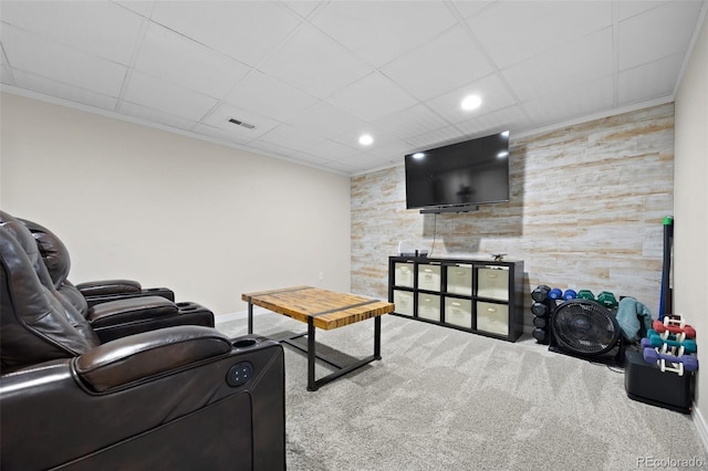 living area with baseboards, ornamental molding, carpet, a drop ceiling, and recessed lighting