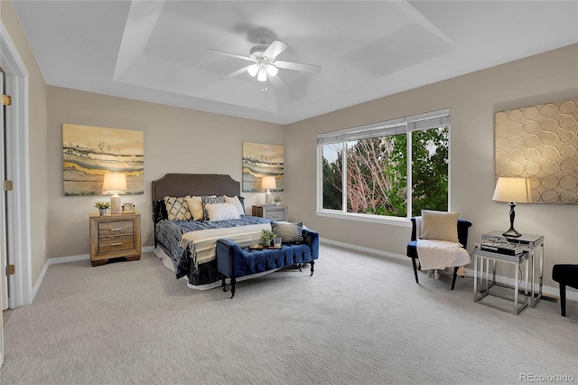 carpeted bedroom with baseboards and ceiling fan