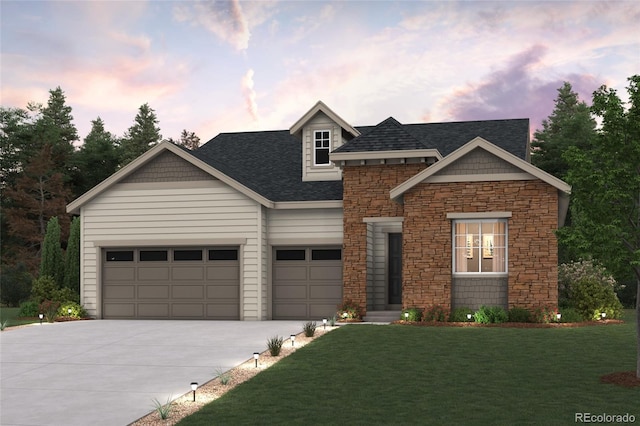 view of front of home with a lawn and a garage