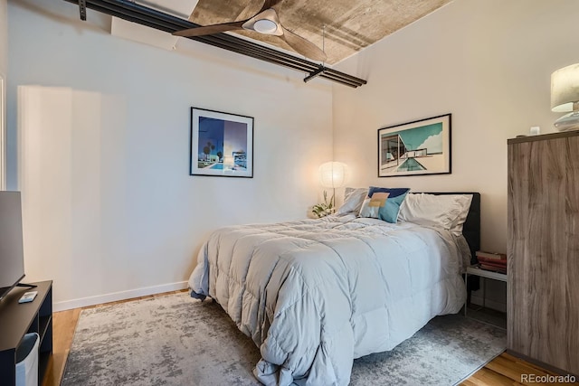 bedroom featuring light wood-type flooring and ceiling fan