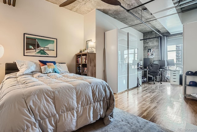 bedroom with hardwood / wood-style floors