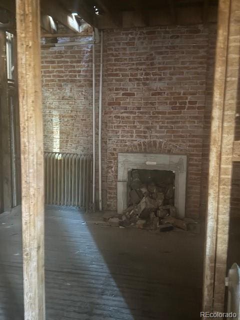 unfurnished living room featuring radiator