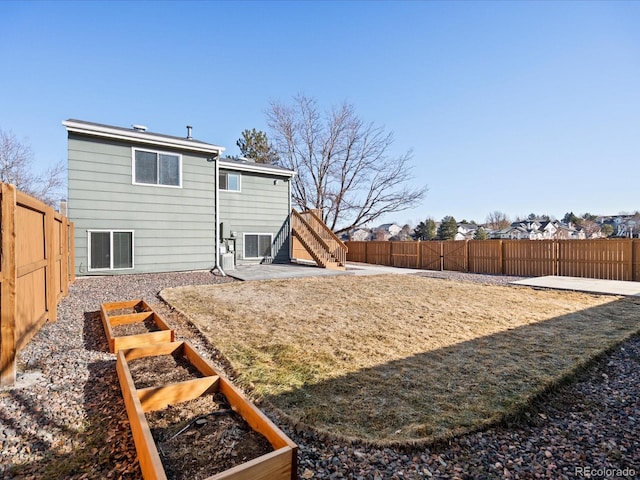 rear view of property featuring a patio area