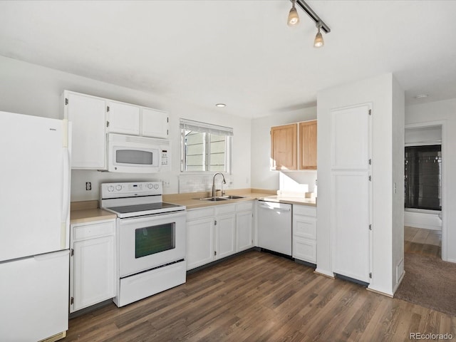 kitchen with white cabinetry, sink, white appliances, and dark hardwood / wood-style floors