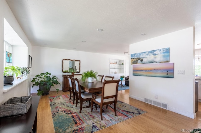 5983 W Indore Pl, Littleton, CO 80128 - dining area featuring light wood-style floors and baseboards