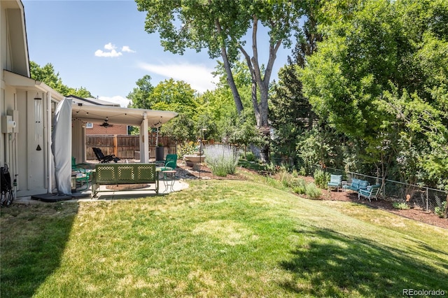 5983 W Indore Pl, Littleton, CO 80128 - fenced backyard with a patio area
