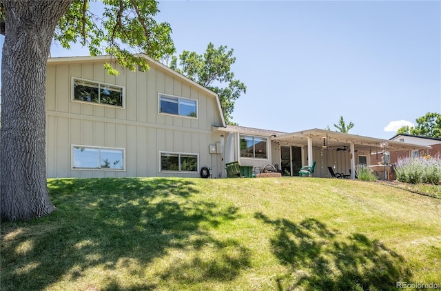5983 W Indore Pl, Littleton, CO 80128 - back of property with board and batten siding and a yard