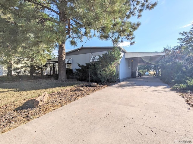 view of front facade with a carport