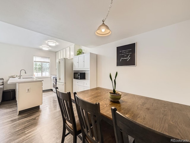 4904 E 125th Ave, Thornton, CO 80241 - dining area featuring wood finished floors