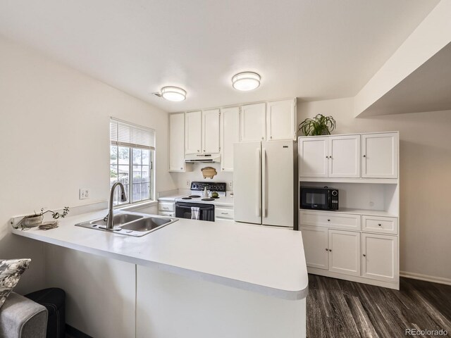 4904 E 125th Ave, Thornton, CO 80241 - kitchen featuring white appliances, a peninsula, white cabinets, dark wood-style flooring, and light countertops