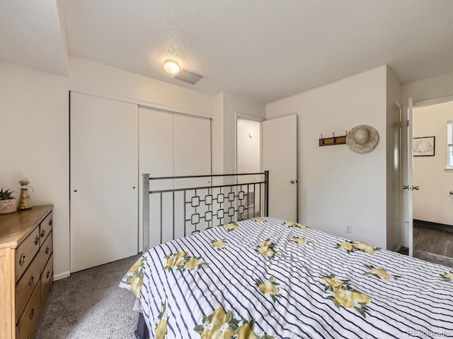 4904 E 125th Ave, Thornton, CO 80241 - carpeted bedroom featuring a closet and a textured ceiling