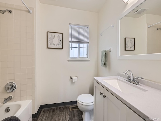 4904 E 125th Ave, Thornton, CO 80241 - bathroom featuring vanity, shower / tub combination, and wood finished floors